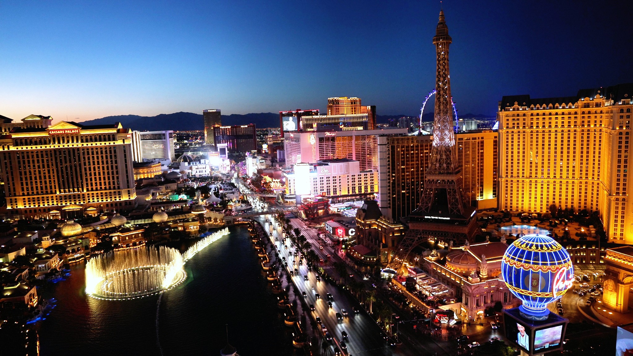 Las Vegas Strip at dusk with the Bellagio fountains and Paris Eiffel Tower